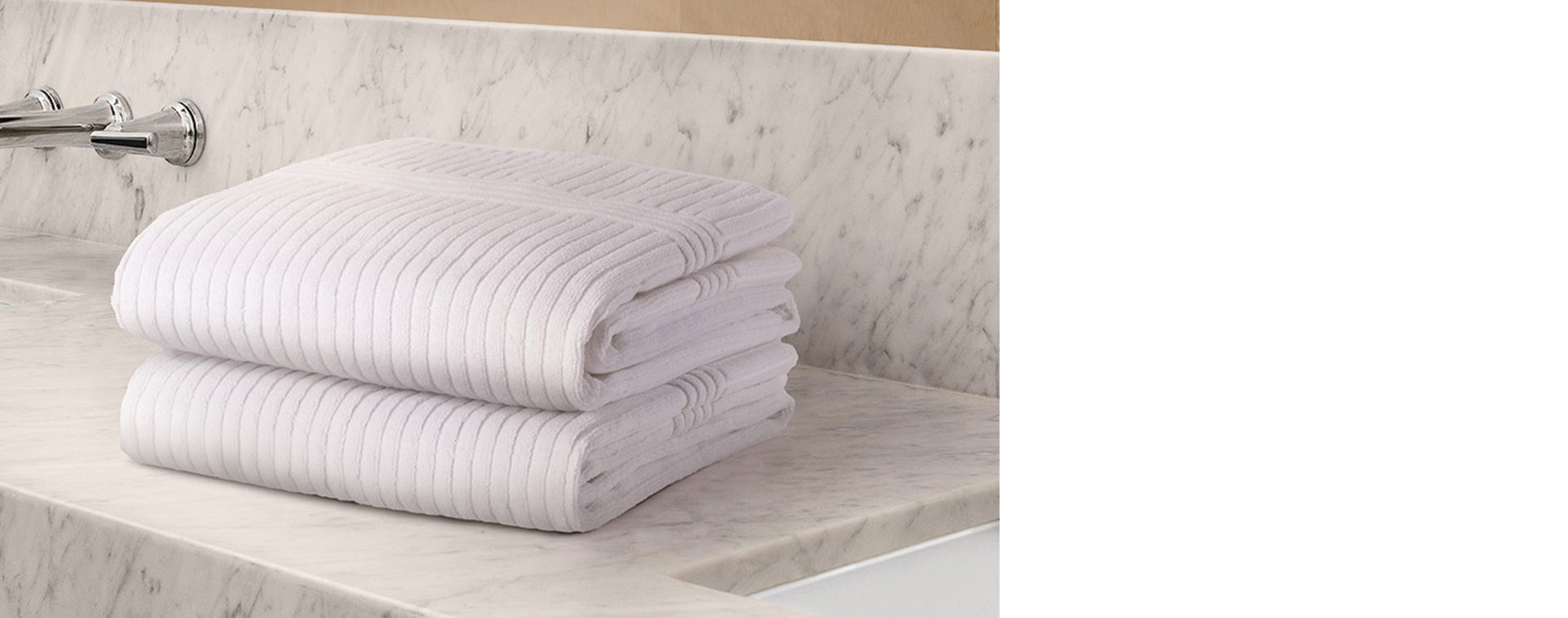 Towels stacked on a marmol top